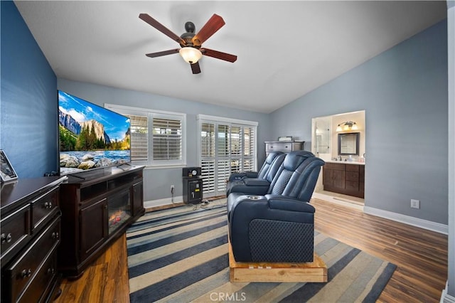 3310 Purple Sage Ln, Palmdale, CA 93550 - living area featuring a ceiling fan, dark wood-type flooring, and vaulted ceiling
