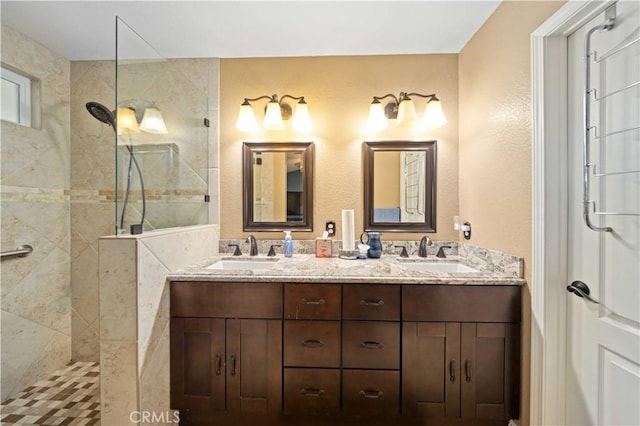 3310 Purple Sage Ln, Palmdale, CA 93550 - bathroom with a walk in shower, double vanity, and a textured wall
