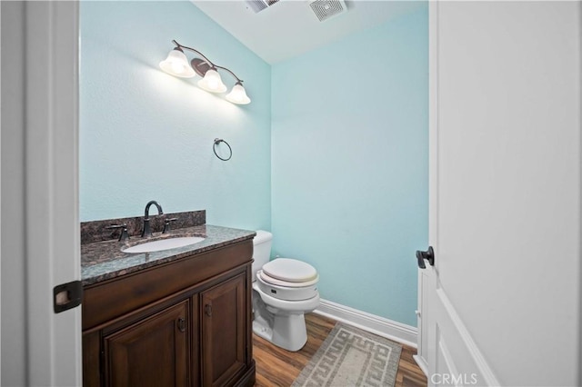 3310 Purple Sage Ln, Palmdale, CA 93550 - half bathroom featuring vanity and wood finished floors