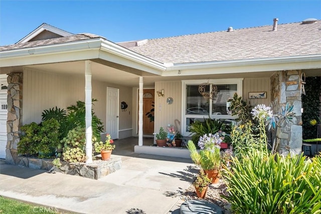 18912 Circle Of The Oaks, Newhall, CA 91321 - view of exterior entry with stone siding, a porch, and a shingled roof