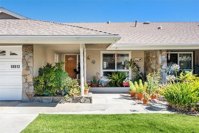 18912 Circle Of The Oaks, Newhall, CA 91321 - entrance to property with stone siding, a shingled roof, and an attached garage