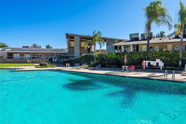 18912 Circle Of The Oaks, Newhall, CA 91321 - community pool featuring a patio