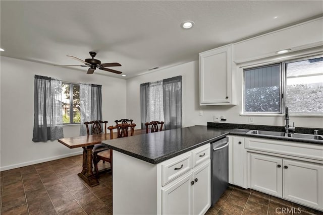 19650 Mountain Mdw N, Hidden Valley Lake, CA 95467 - kitchen featuring stainless steel dishwasher, a peninsula, a ceiling fan, white cabinetry, and recessed lighting