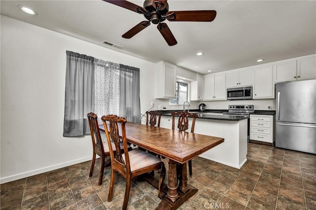 19650 Mountain Mdw N, Hidden Valley Lake, CA 95467 - dining room featuring ceiling fan, recessed lighting, and stone finish flooring