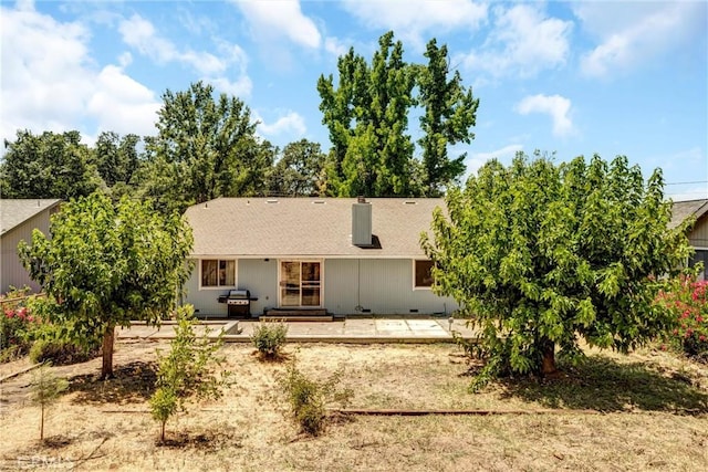 19650 Mountain Mdw N, Hidden Valley Lake, CA 95467 - rear view of house with a patio area, a shingled roof, and a chimney