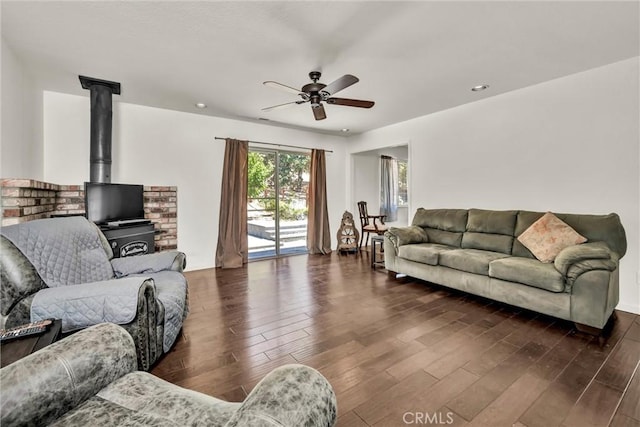 19650 Mountain Mdw N, Hidden Valley Lake, CA 95467 - living room with a ceiling fan, dark wood-style floors, a wood stove, and recessed lighting