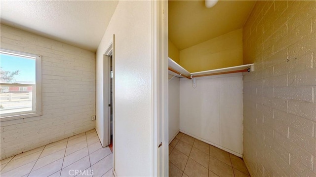21845 Fox Ave, Apple Valley, CA 92307 - spacious closet featuring light tile patterned floors