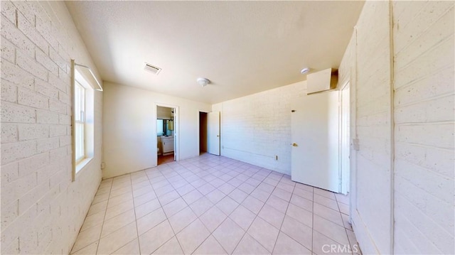 21845 Fox Ave, Apple Valley, CA 92307 - unfurnished bedroom featuring brick wall