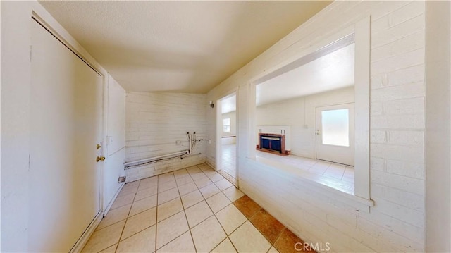 21845 Fox Ave, Apple Valley, CA 92307 - bathroom featuring tile patterned flooring, plenty of natural light, and a fireplace