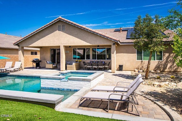 84319 Cigno Ct, Indio, CA 92203 - view of pool featuring an outdoor hangout area, area for grilling, a pool with connected hot tub, a patio area, and outdoor dining space