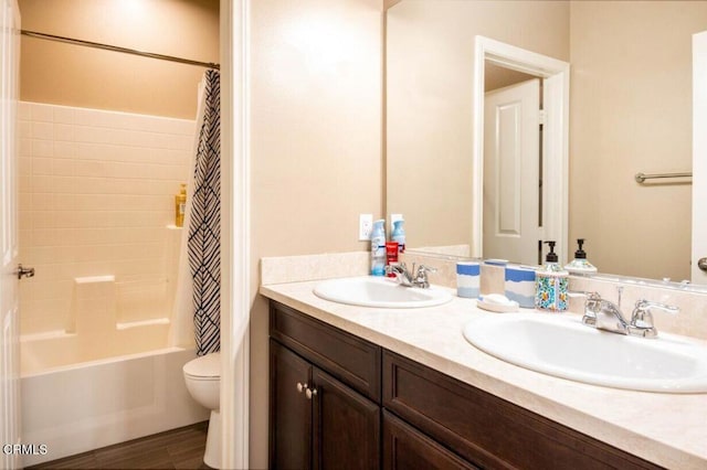 84319 Cigno Ct, Indio, CA 92203 - bathroom featuring double vanity, shower / tub combo with curtain, and wood finished floors