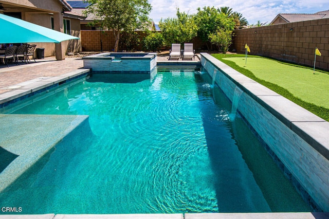 84319 Cigno Ct, Indio, CA 92203 - view of swimming pool featuring an area to practice putting, a fenced backyard, a patio, and a pool with connected hot tub