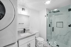 25152 Mammoth Cir, Lake Forest, CA 92630 - full bathroom featuring washer / dryer, vanity, and a marble finish shower