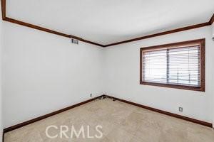 25152 Mammoth Cir, Lake Forest, CA 92630 - spare room with ornamental molding and light colored carpet