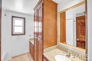 25152 Mammoth Cir, Lake Forest, CA 92630 - bathroom with vanity and baseboards
