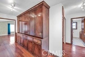 25152 Mammoth Cir, Lake Forest, CA 92630 - hall featuring light wood-style floors and track lighting