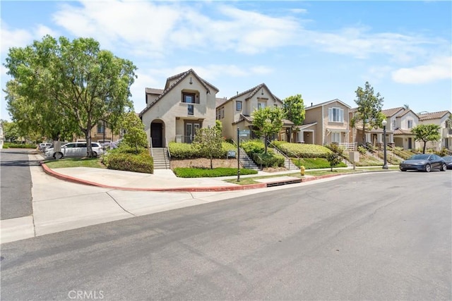 1335 Mc Fadden Dr, Fullerton, CA 92833 - view of front of house featuring a residential view and stucco siding