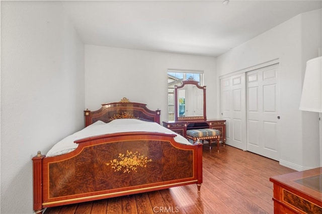 1335 Mc Fadden Dr, Fullerton, CA 92833 - bedroom featuring wood finished floors and a closet