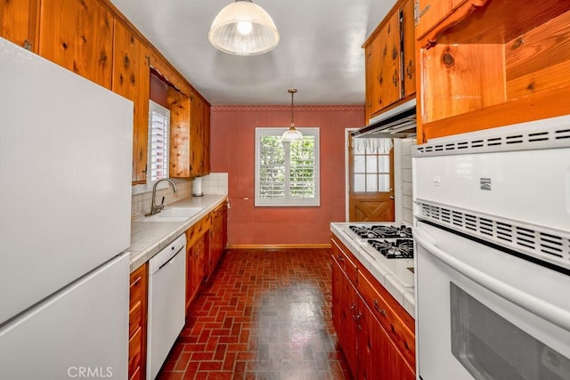 11009 Quill Ave, Sunland, CA 91040 - kitchen featuring white appliances, brick patterned floors, light countertops, under cabinet range hood, and tasteful backsplash