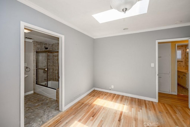 11009 Quill Ave, Sunland, CA 91040 - unfurnished bedroom featuring a skylight, light wood-type flooring, and ornamental molding