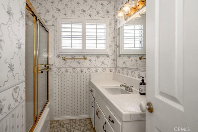11009 Quill Ave, Sunland, CA 91040 - bathroom featuring vanity, bath / shower combo with glass door, and wallpapered walls