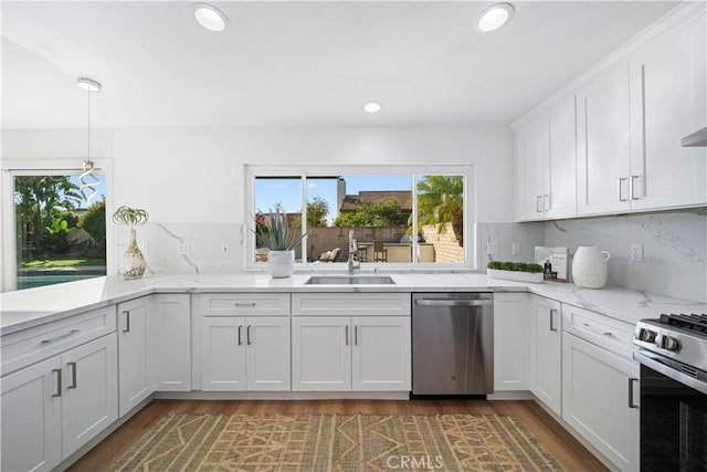 24861 Camberwell St, Laguna Hills, CA 92653 - kitchen featuring appliances with stainless steel finishes, recessed lighting, white cabinetry, dark wood-style flooring, and backsplash