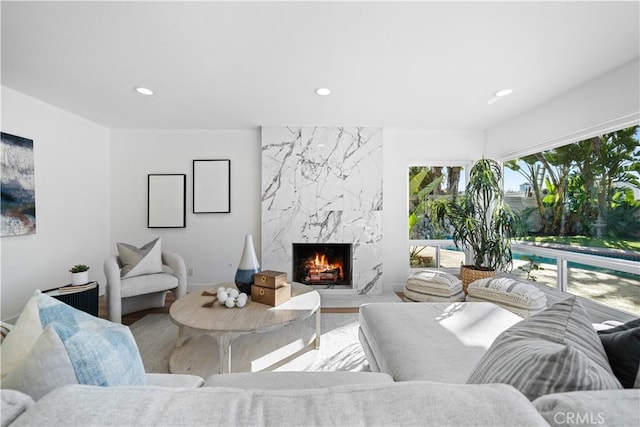 24861 Camberwell St, Laguna Hills, CA 92653 - living room with wood finished floors, a high end fireplace, and recessed lighting