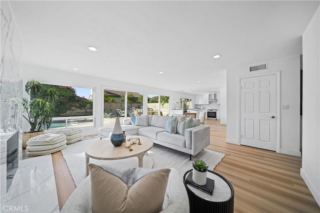 24861 Camberwell St, Laguna Hills, CA 92653 - living area featuring healthy amount of natural light, recessed lighting, and light wood-type flooring