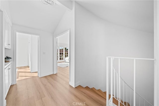 24861 Camberwell St, Laguna Hills, CA 92653 - hallway featuring an upstairs landing, light wood-style floors, and lofted ceiling