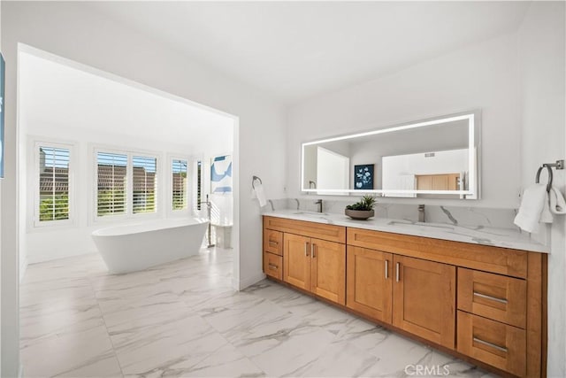24861 Camberwell St, Laguna Hills, CA 92653 - full bathroom featuring marble finish flooring, double vanity, and a freestanding bath