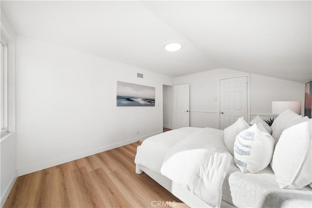 24861 Camberwell St, Laguna Hills, CA 92653 - bedroom featuring light wood finished floors and lofted ceiling