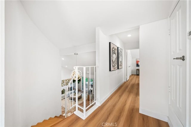 24861 Camberwell St, Laguna Hills, CA 92653 - hallway featuring wood finished floors, recessed lighting, and an upstairs landing