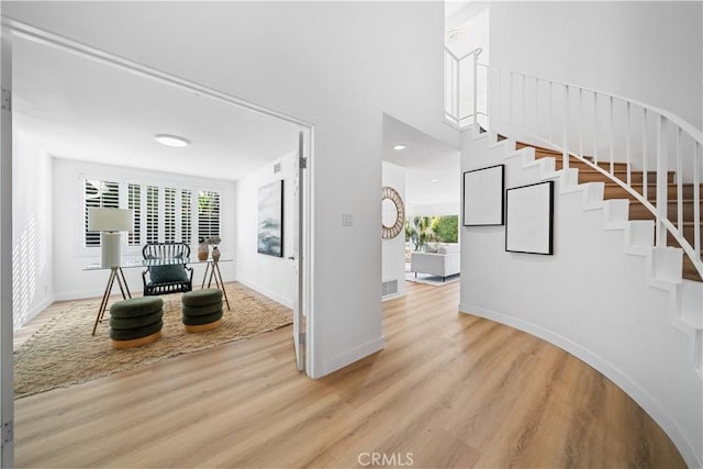 24861 Camberwell St, Laguna Hills, CA 92653 - entrance foyer featuring light wood-style flooring, healthy amount of natural light, and stairway