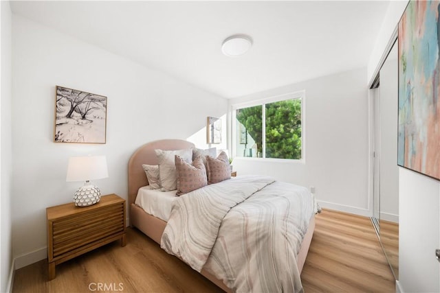 24861 Camberwell St, Laguna Hills, CA 92653 - bedroom featuring wood finished floors and a closet