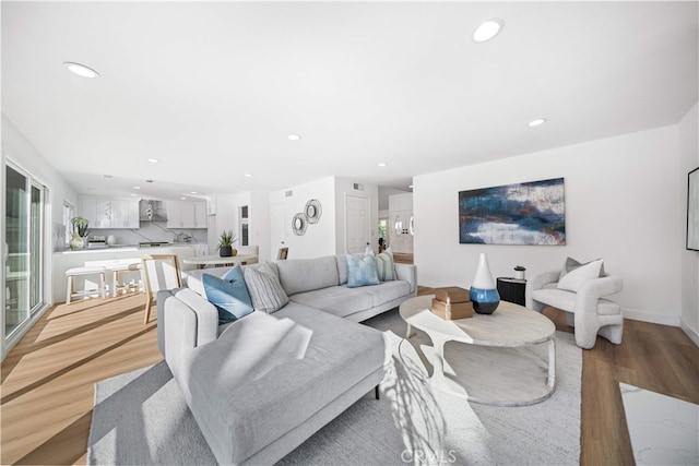 24861 Camberwell St, Laguna Hills, CA 92653 - living room with light wood finished floors and recessed lighting