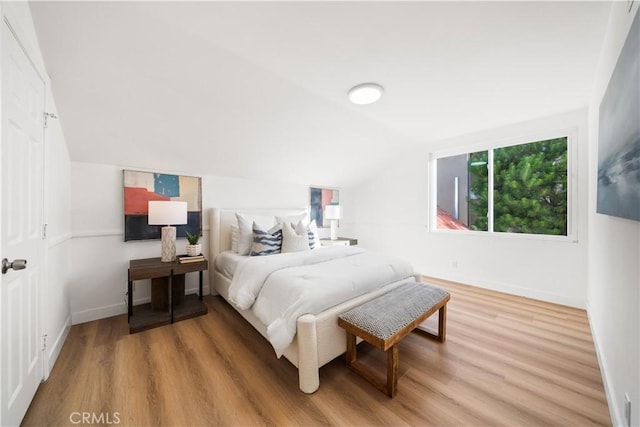 24861 Camberwell St, Laguna Hills, CA 92653 - bedroom featuring light wood-style floors and vaulted ceiling