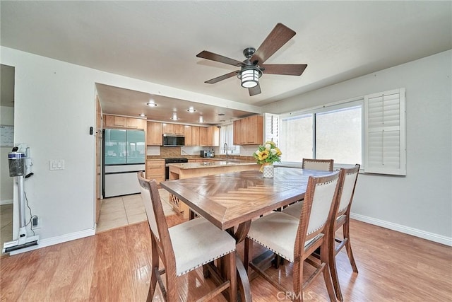 2424 S Gaffey St Unit 101, San Pedro, CA 90731 - dining area with ceiling fan and light wood-style flooring