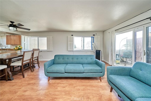 2424 S Gaffey St Unit 101, San Pedro, CA 90731 - living area with light wood-type flooring and a ceiling fan