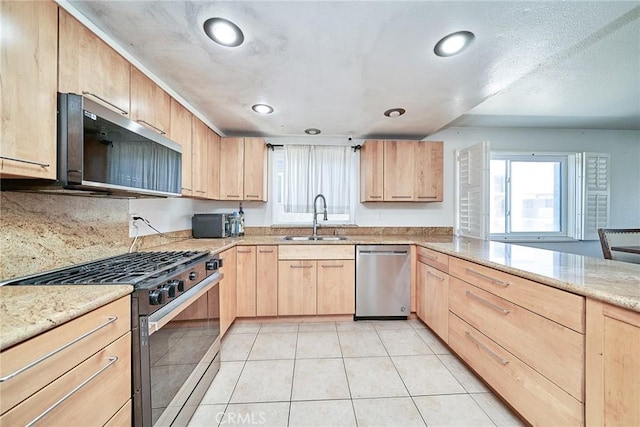 2424 S Gaffey St Unit 101, San Pedro, CA 90731 - kitchen with stainless steel appliances, light brown cabinets, healthy amount of natural light, and recessed lighting
