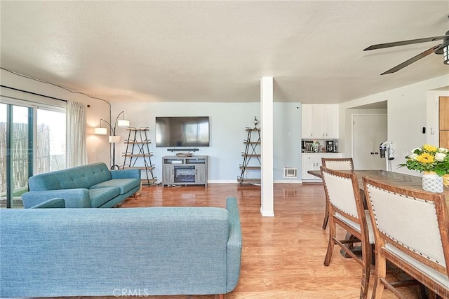 2424 S Gaffey St Unit 101, San Pedro, CA 90731 - living area with a ceiling fan and light wood finished floors