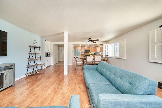2424 S Gaffey St Unit 101, San Pedro, CA 90731 - living area featuring a ceiling fan and light wood-type flooring