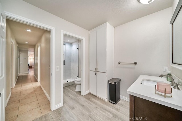 2424 S Gaffey St Unit 101, San Pedro, CA 90731 - full bath featuring a stall shower, vanity, and wood finished floors