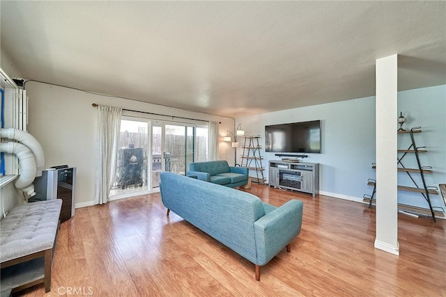 2424 S Gaffey St Unit 101, San Pedro, CA 90731 - living area featuring light wood-style floors and baseboards