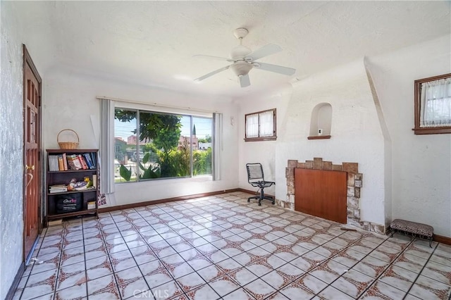 2439 California St, Walnut Park, CA 90255 - living area featuring a ceiling fan and light tile patterned floors