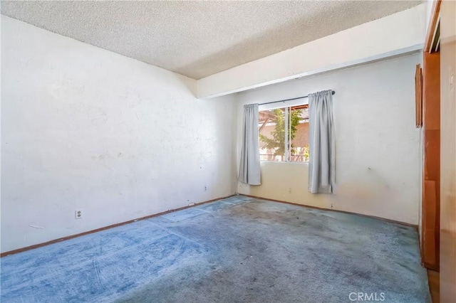 2439 California St, Walnut Park, CA 90255 - empty room featuring a textured ceiling and carpet floors
