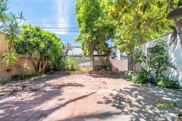 2439 California St, Walnut Park, CA 90255 - fenced backyard with a patio
