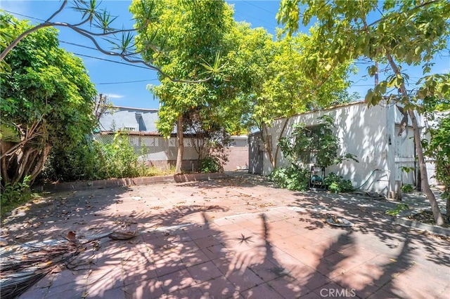 2439 California St, Walnut Park, CA 90255 - fenced backyard featuring a patio