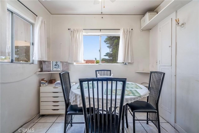 2439 California St, Walnut Park, CA 90255 - dining area with healthy amount of natural light, light tile patterned floors, and a ceiling fan
