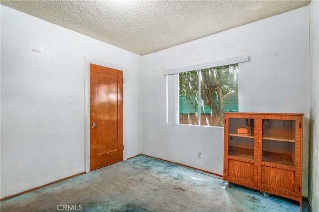 2439 California St, Walnut Park, CA 90255 - carpeted empty room featuring a textured ceiling