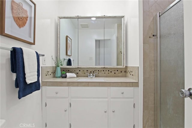 545 Chestnut Ave Unit 411, Long Beach, CA 90802 - bathroom with a stall shower, tasteful backsplash, and vanity